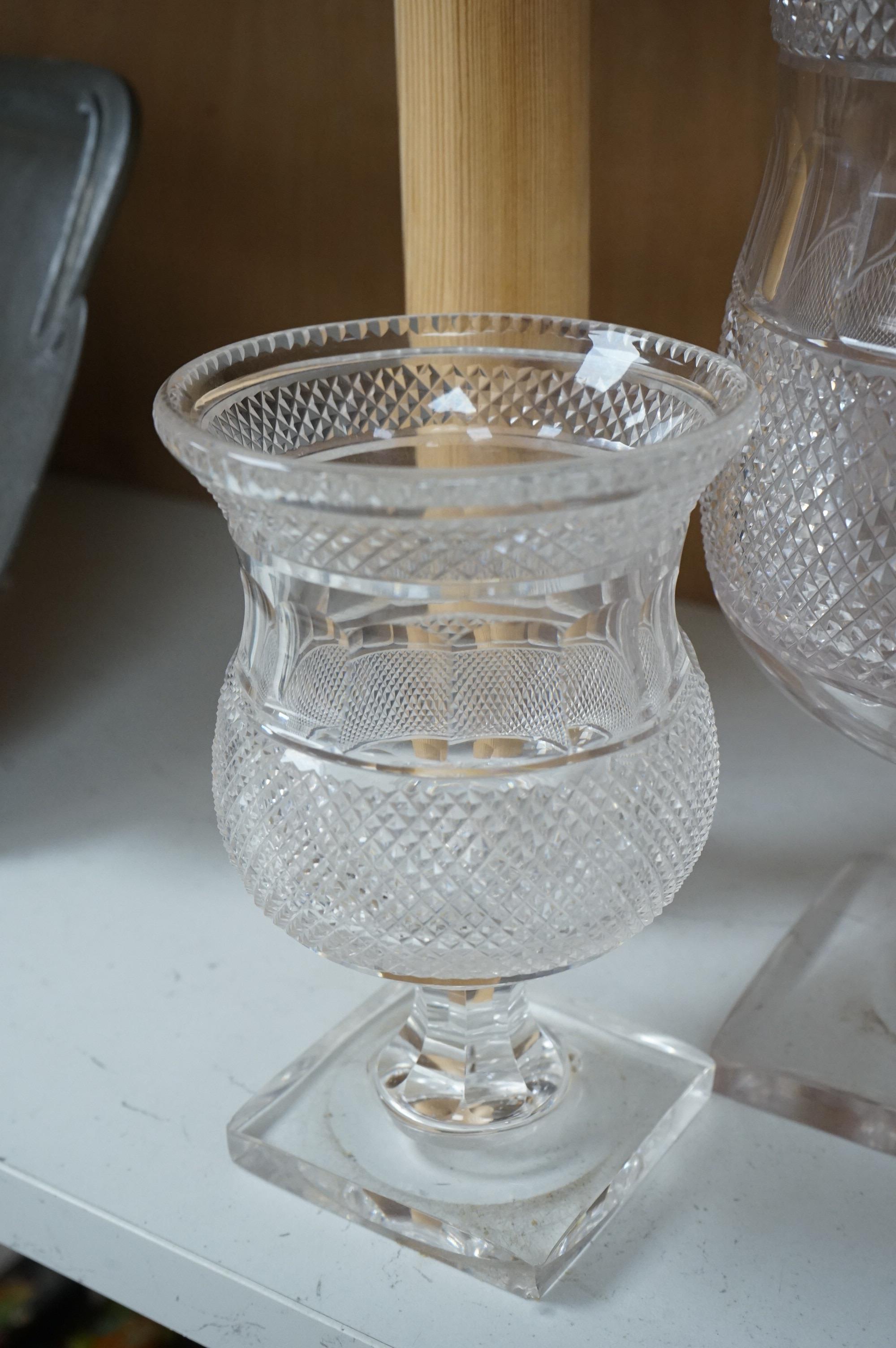 A garniture of three 19th century cut glass vases, largest 26cm high